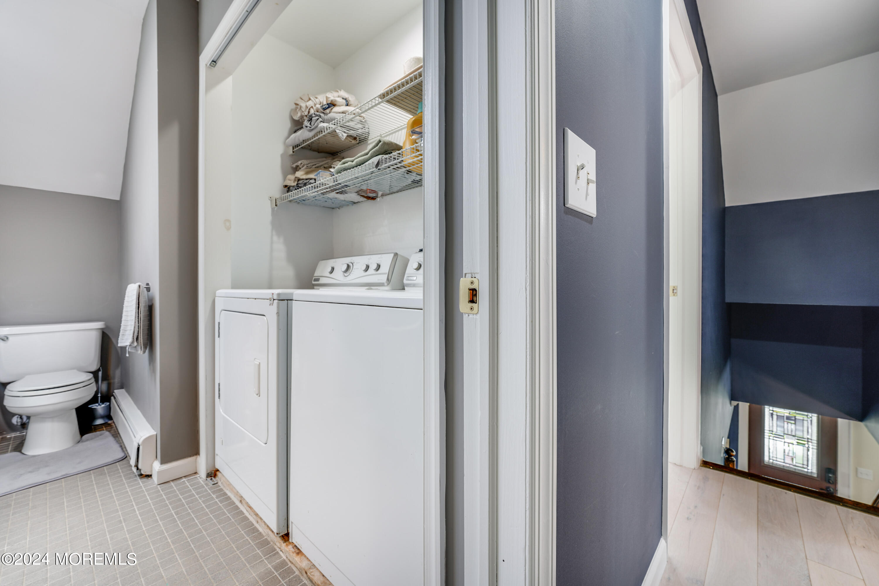 500 Locust Point Road Rumson, NJ 07760 - Photo 19 of 48 a view of a hallway to rooms and wooden floor