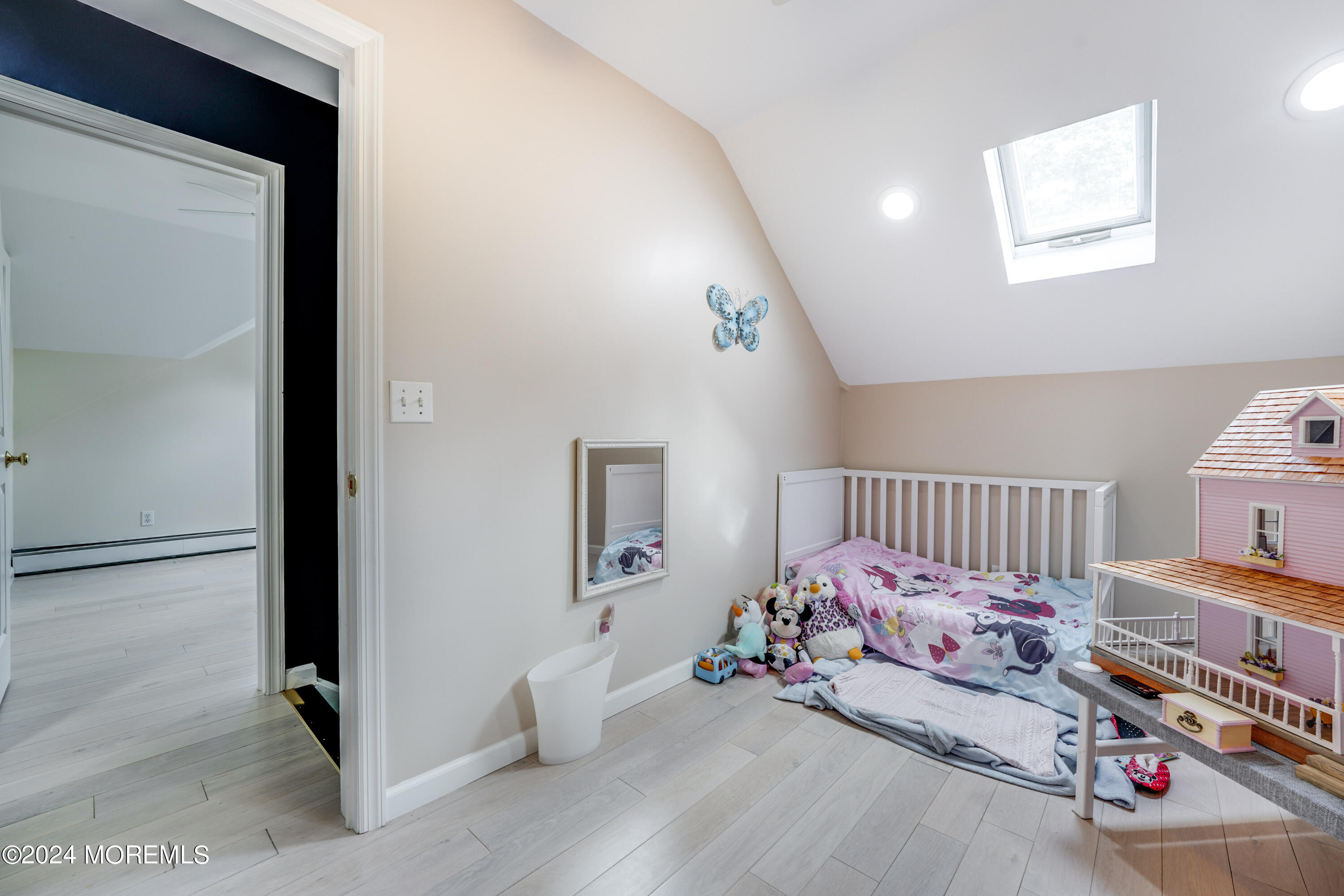 500 Locust Point Road Rumson, NJ 07760 - Photo 22 of 48 a bedroom with furniture and a book shelf