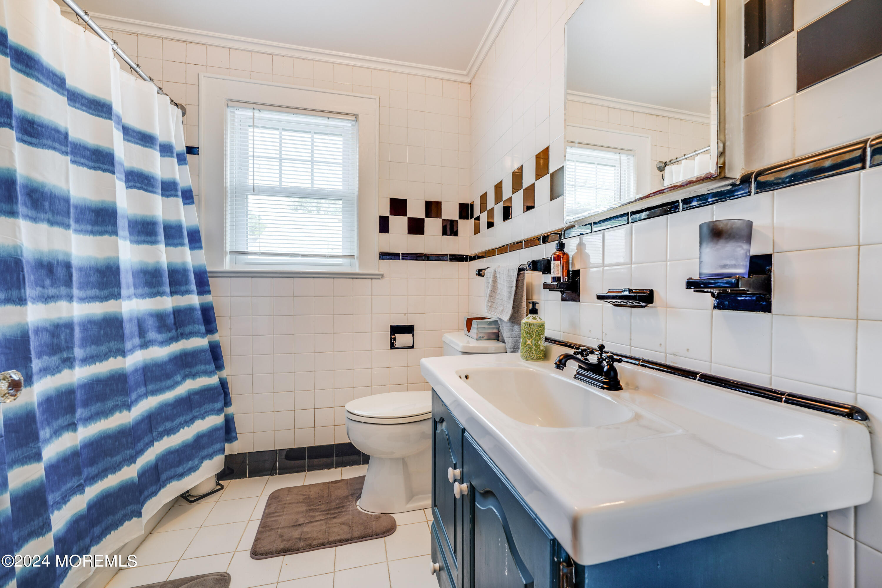 500 Locust Point Road Rumson, NJ 07760 - Photo 29 of 48 a bathroom with a sink a toilet and shower