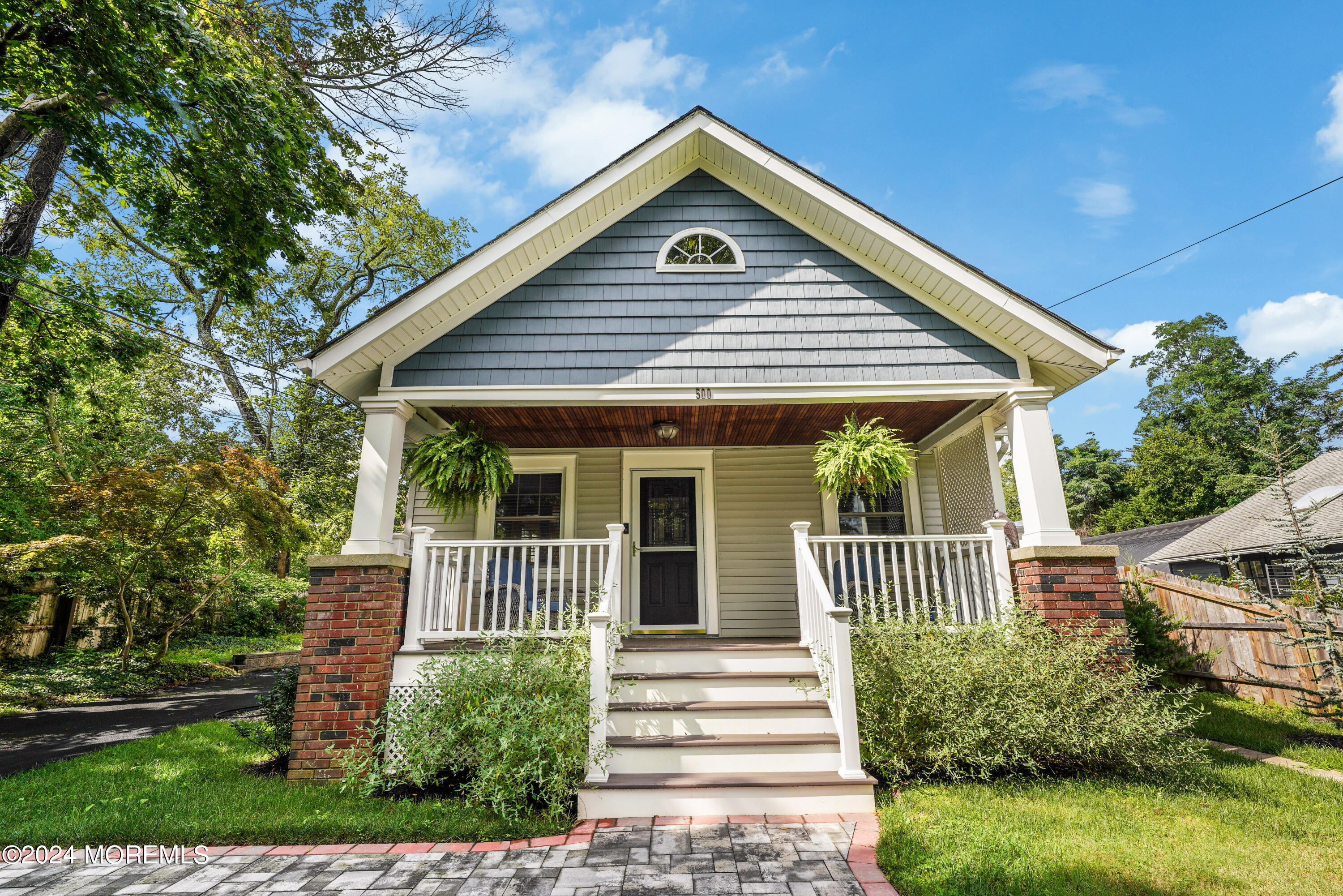 500 Locust Point Road Rumson, NJ 07760 - Photo 36 of 48 a front view of a house with a porch