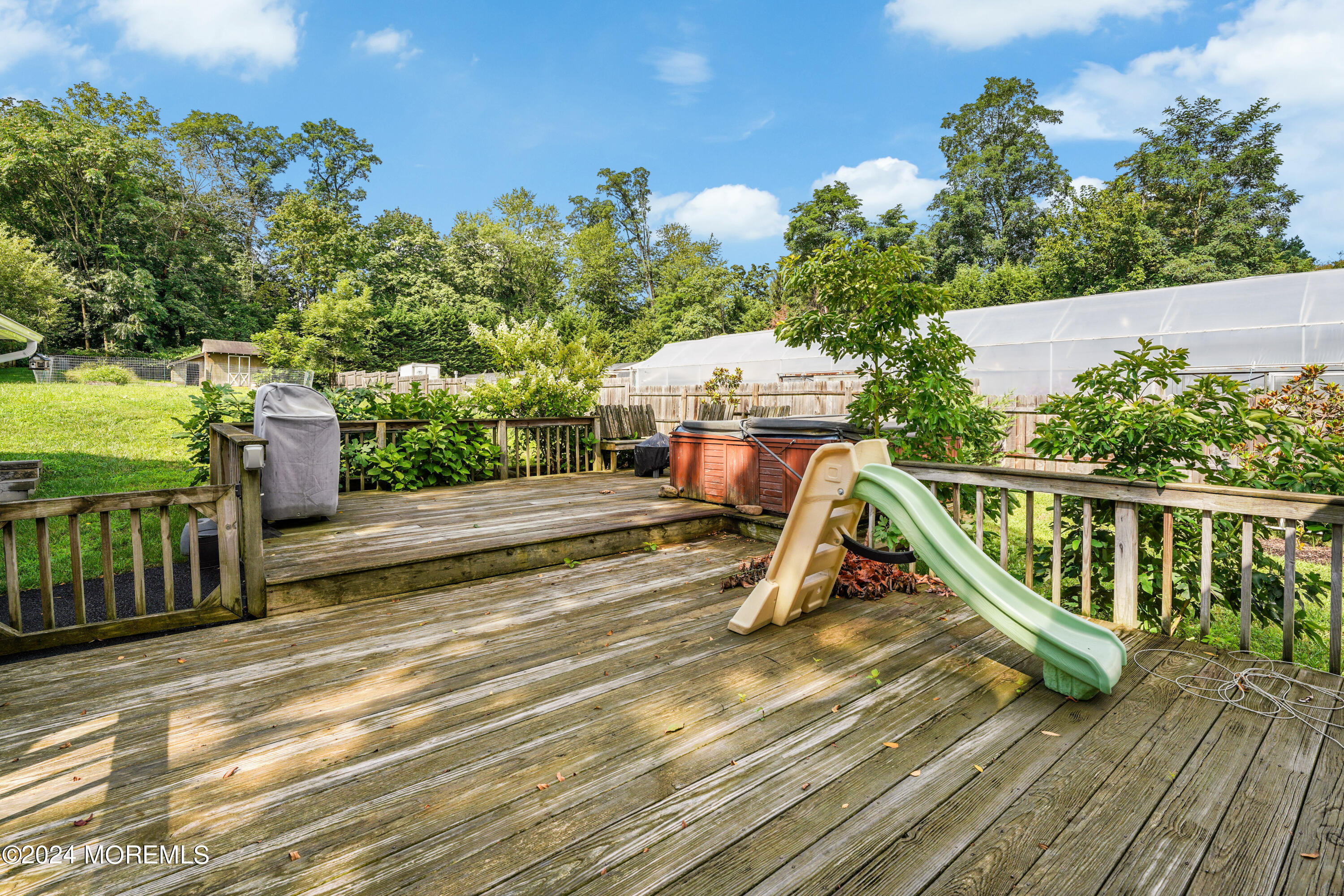 500 Locust Point Road Rumson, NJ 07760 - Photo 37 of 48 a view of a deck with wooden floor and fence with a bench