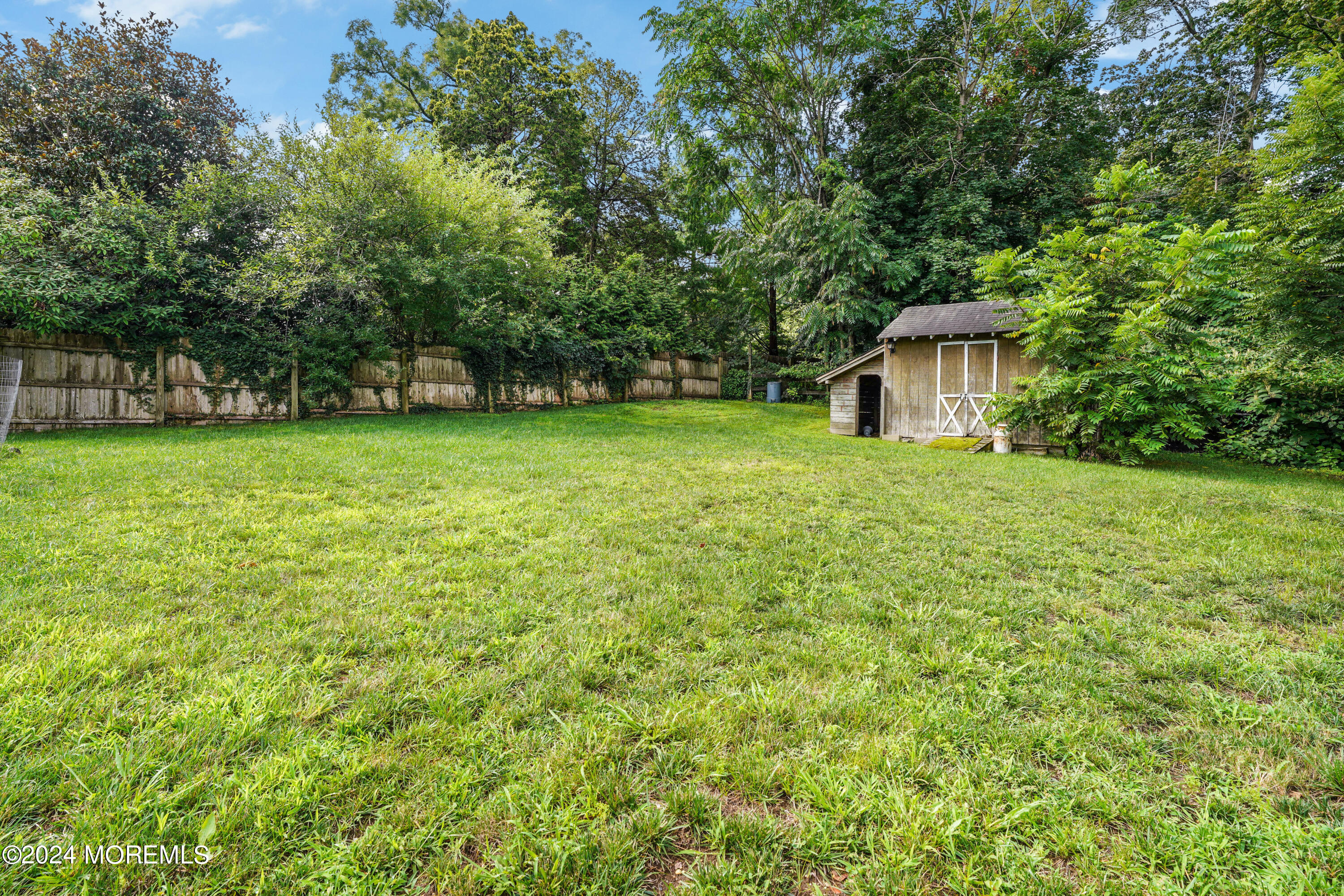 500 Locust Point Road Rumson, NJ 07760 - Photo 39 of 48 a view of a tiny house with a garden