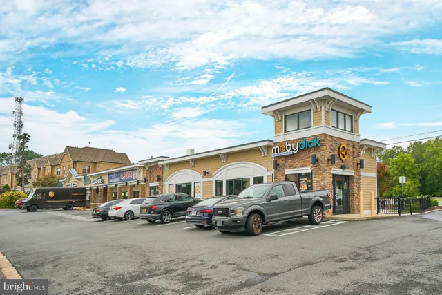 a car parked in front of a brick building