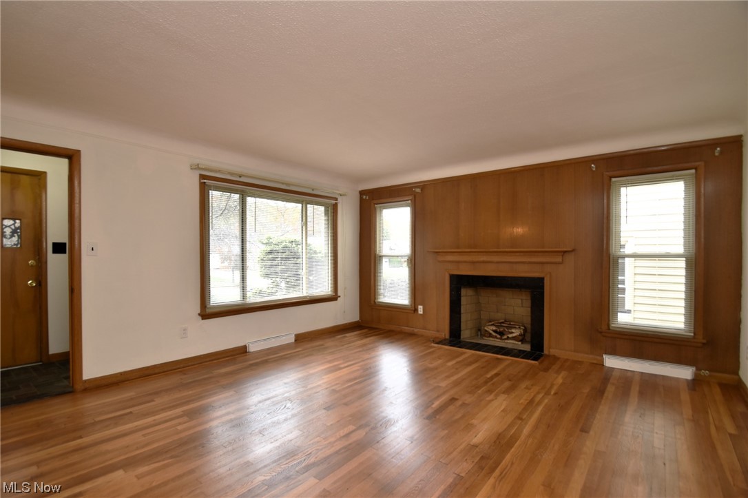 3681 Brinkmore Road Cleveland Heights, OH 44121 - Photo 5 of 27 Unfurnished living room featuring plenty of natural light and wood-type flooring