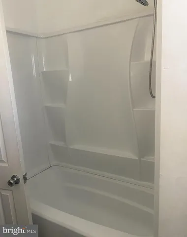 a close view of a bathtub in bathroom