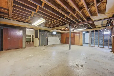a view of empty room with wooden ceiling