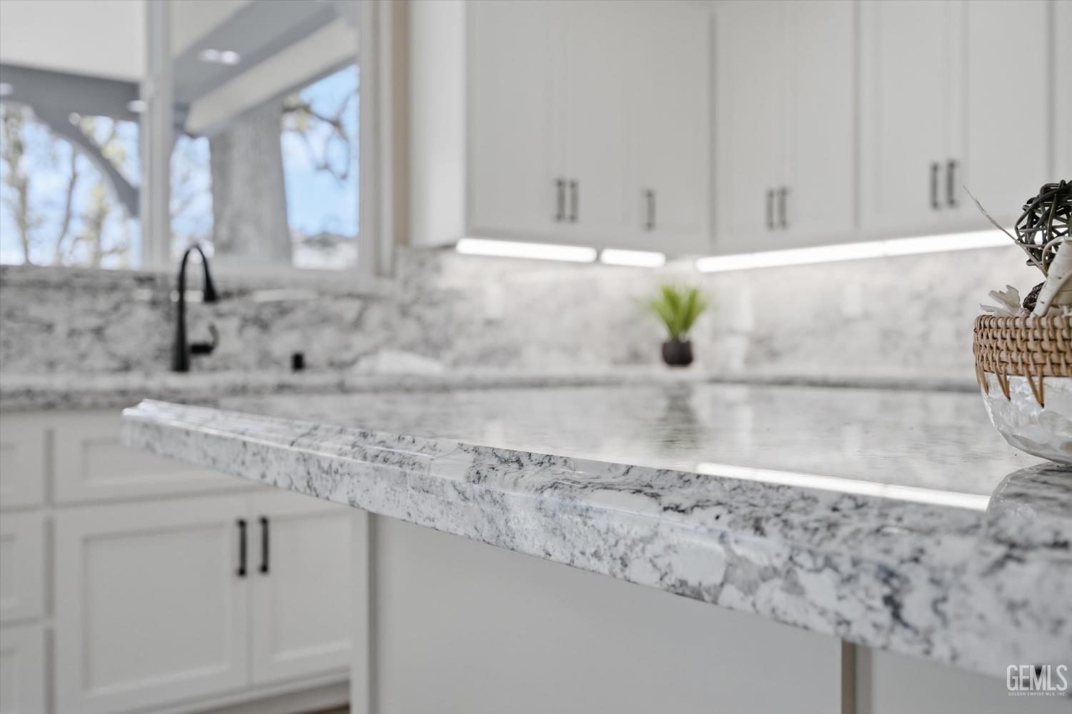 Undisclosed Address Tehachapi, CA 93561 - Photo 24 of 47 a kitchen with granite countertop white cabinets and a sink