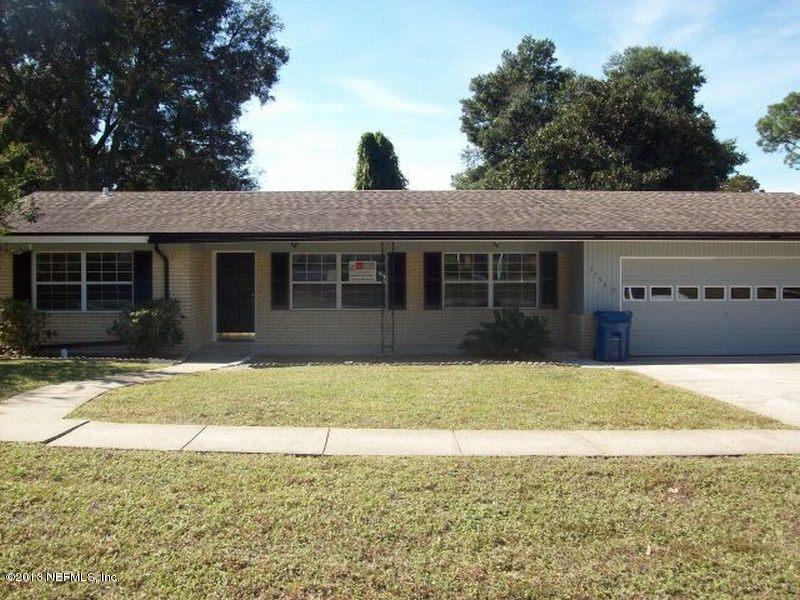 3750 Heath Road Jacksonville, FL 32277 - Photo 1 of 12 a house that has a tree in front of it