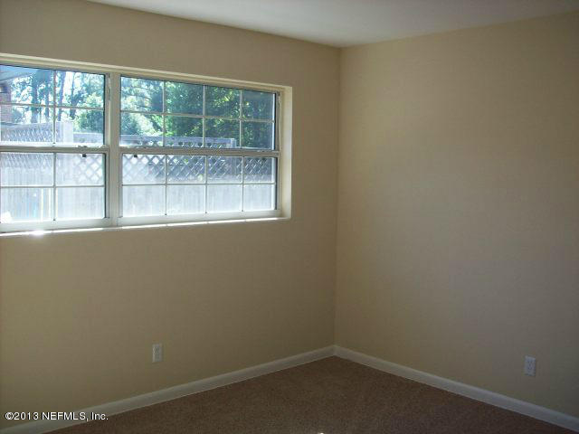 3750 Heath Road Jacksonville, FL 32277 - Photo 7 of 12 an empty room with a window