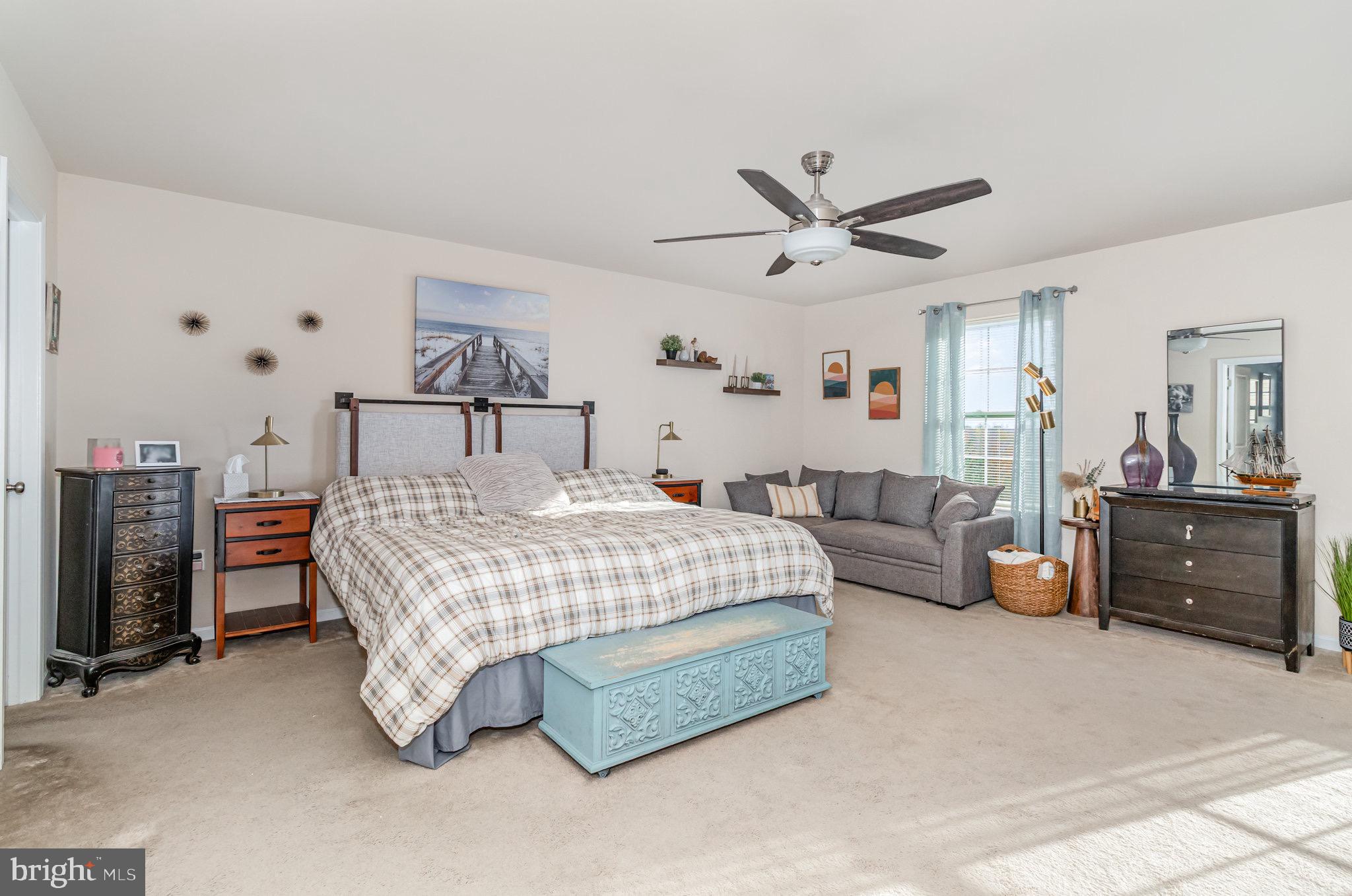 1799 Campus Road Elizabethtown, PA 17022 - Photo 20 of 28 a bedroom with bed and a chandelier