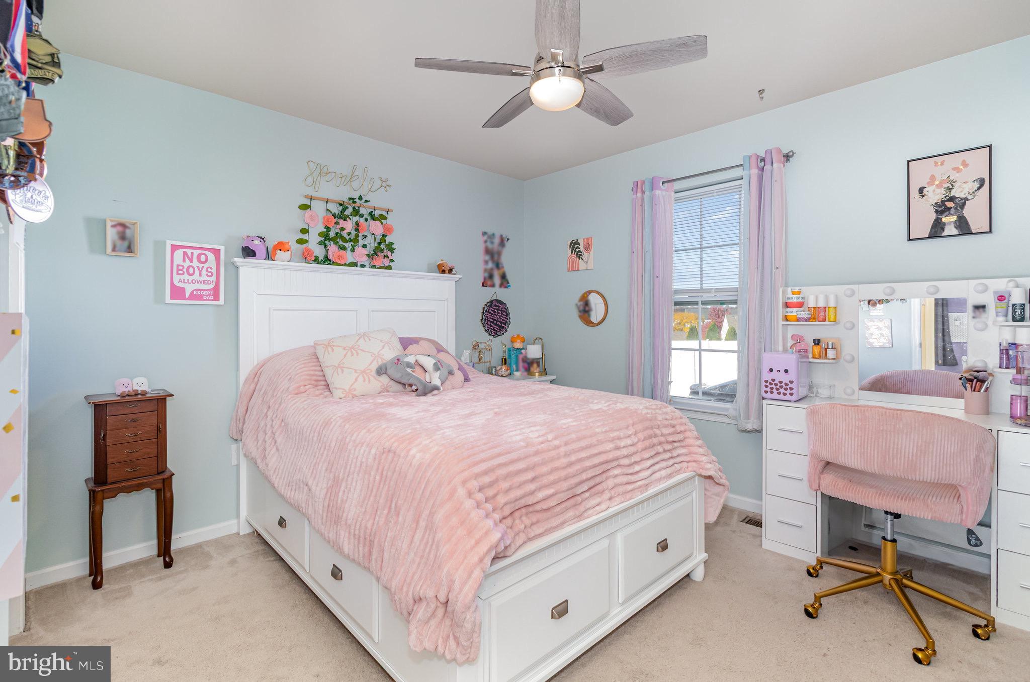1799 Campus Road Elizabethtown, PA 17022 - Photo 23 of 28 a bedroom with a bed a desk and chair next to a window