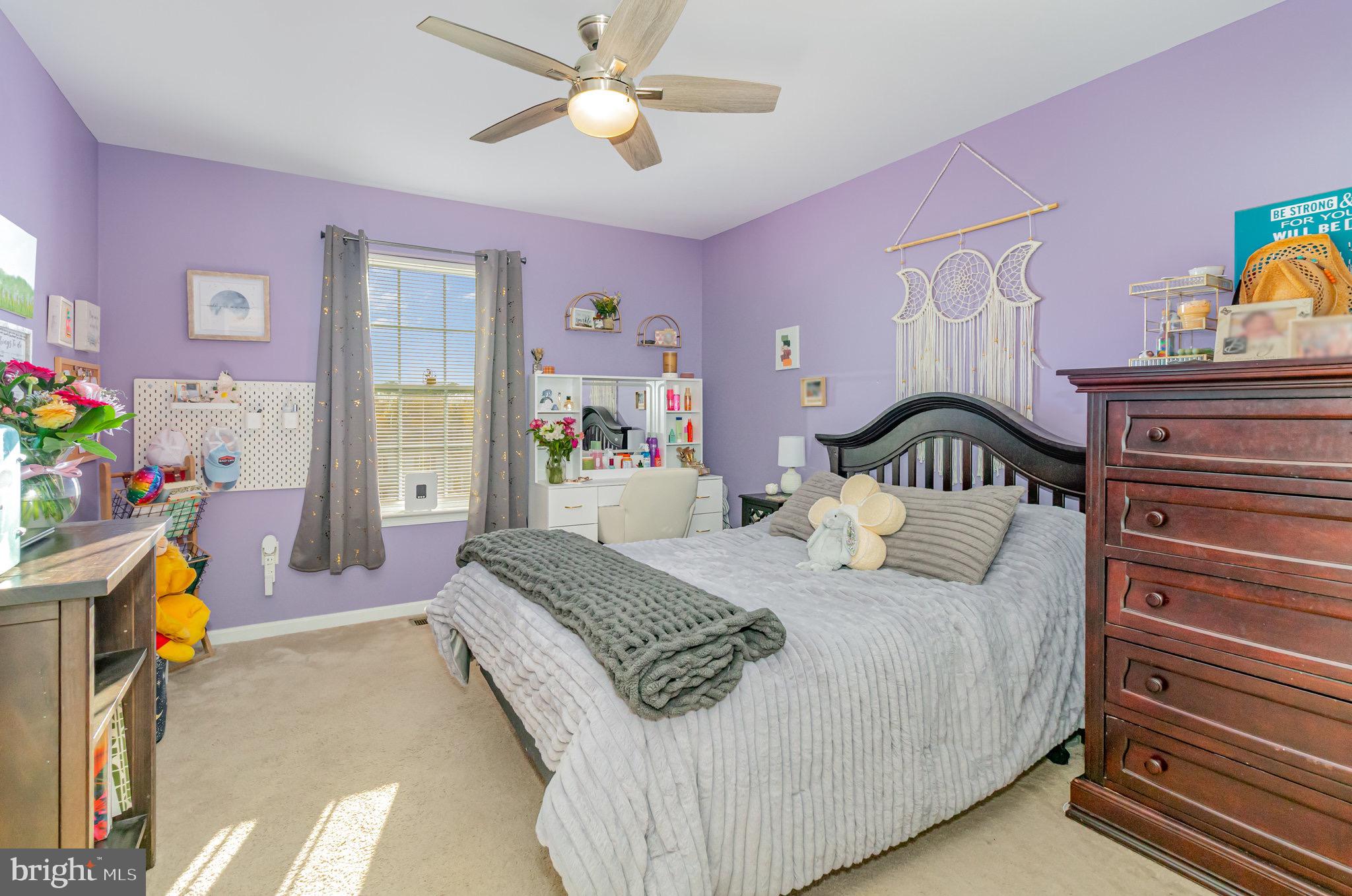 1799 Campus Road Elizabethtown, PA 17022 - Photo 25 of 28 a bedroom with a bed a chandelier and dresser