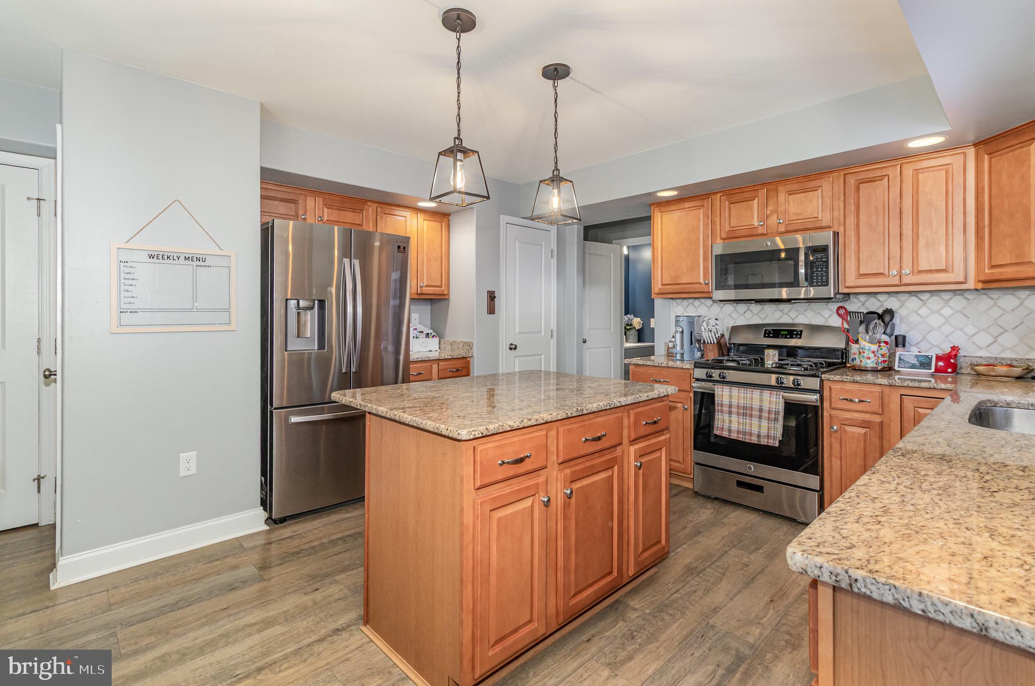 1799 Campus Road Elizabethtown, PA 17022 - Photo 10 of 28 a kitchen with stainless steel appliances granite countertop a stove and a refrigerator