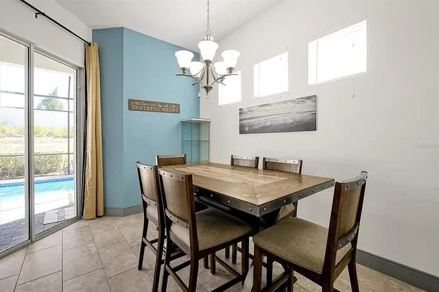 a kitchen with stainless steel appliances kitchen island granite countertop a stove and cabinets
