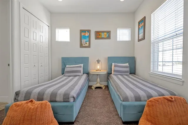 a bedroom with a bed and lamp