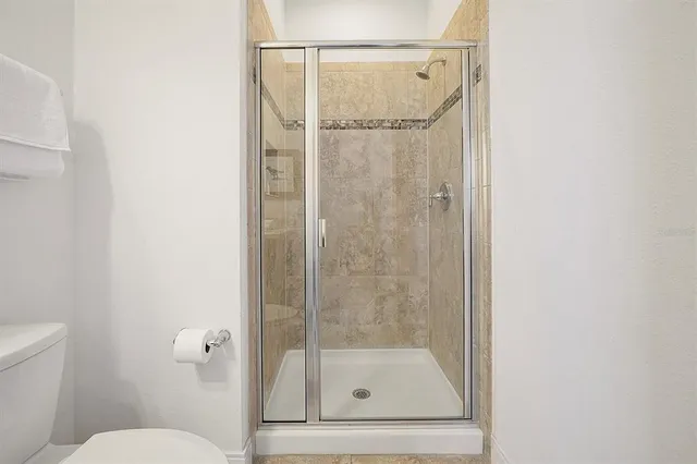 a view of a park with large trees