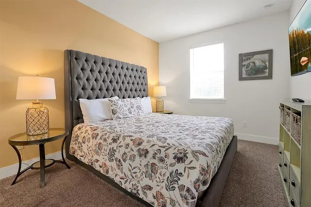 an aerial view of a house with garden space and outdoor seating