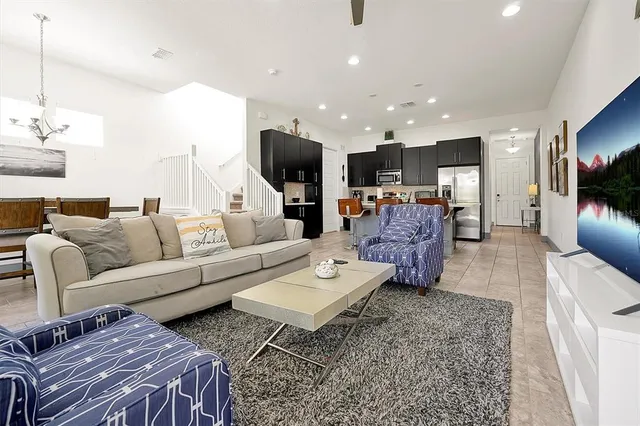 a view of a dining room that has a table and chairs