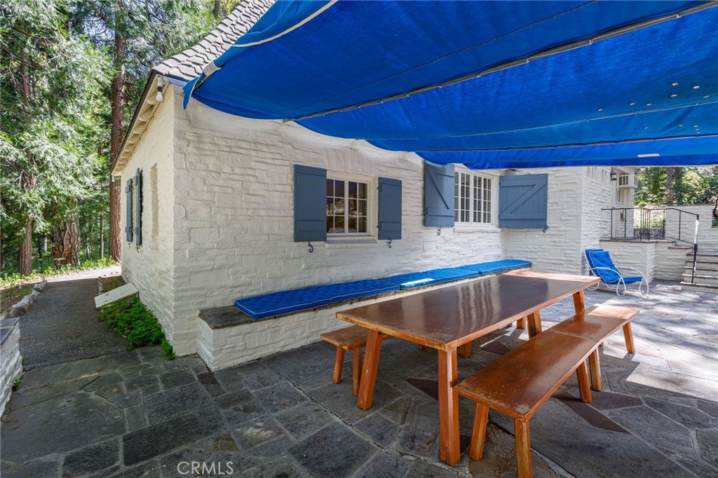 28641 North Shore Road Lake Arrowhead, CA 92352 - Photo 23 of 75 a view of a backyard with furniture and outdoor seating