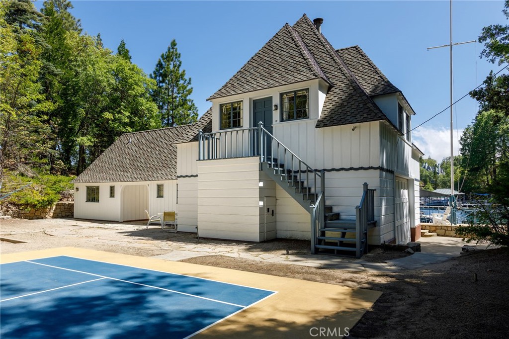 28641 North Shore Road Lake Arrowhead, CA 92352 - Photo 28 of 75 a view of a house with a wooden fence