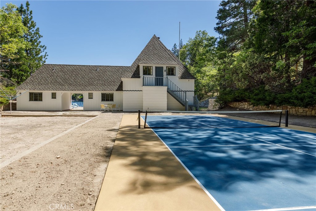 28641 North Shore Road Lake Arrowhead, CA 92352 - Photo 30 of 75 a front view of a house with a yard