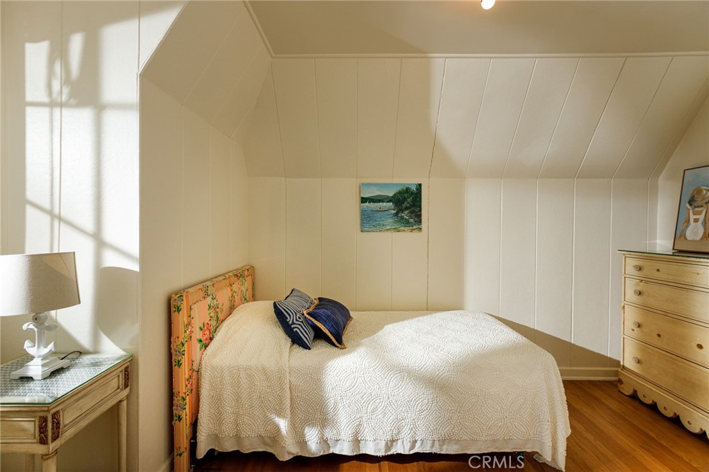 28641 North Shore Road Lake Arrowhead, CA 92352 - Photo 32 of 75 a bedroom with a bed and wooden floor