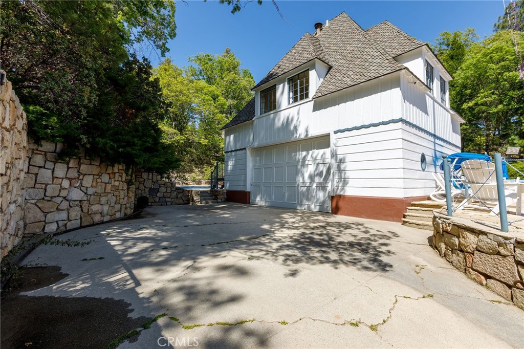28641 North Shore Road Lake Arrowhead, CA 92352 - Photo 37 of 75 a view of a house with a yard