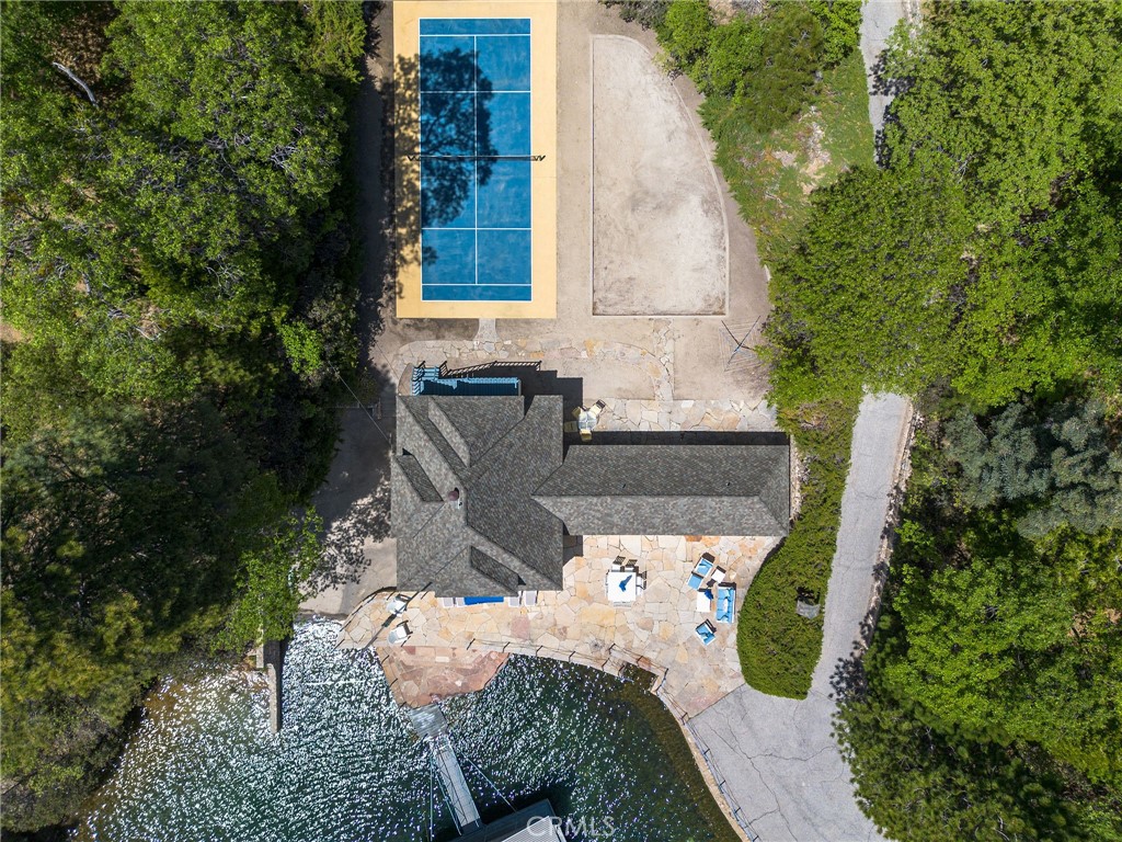 28641 North Shore Road Lake Arrowhead, CA 92352 - Photo 49 of 75 a view of a chair and table in backyard