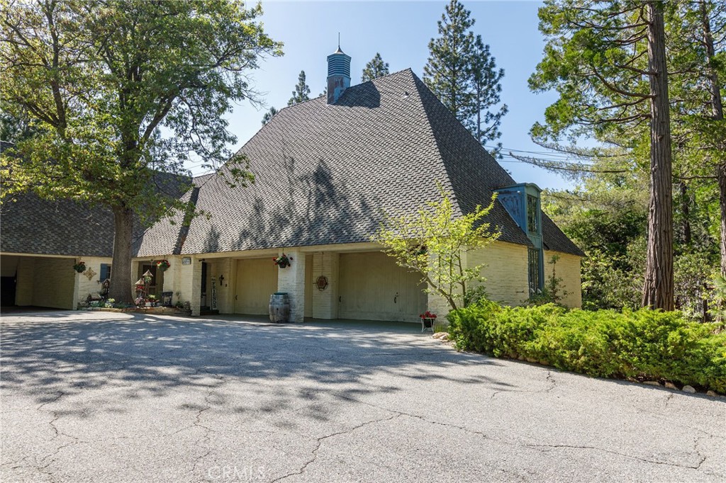 28641 North Shore Road Lake Arrowhead, CA 92352 - Photo 52 of 75 a view of a house with a tree