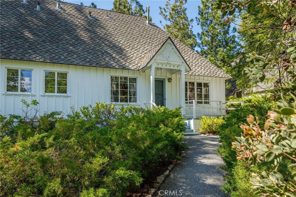 28641 North Shore Road Lake Arrowhead, CA 92352 - Photo 59 of 75 a view of a house with potted plants and large tree