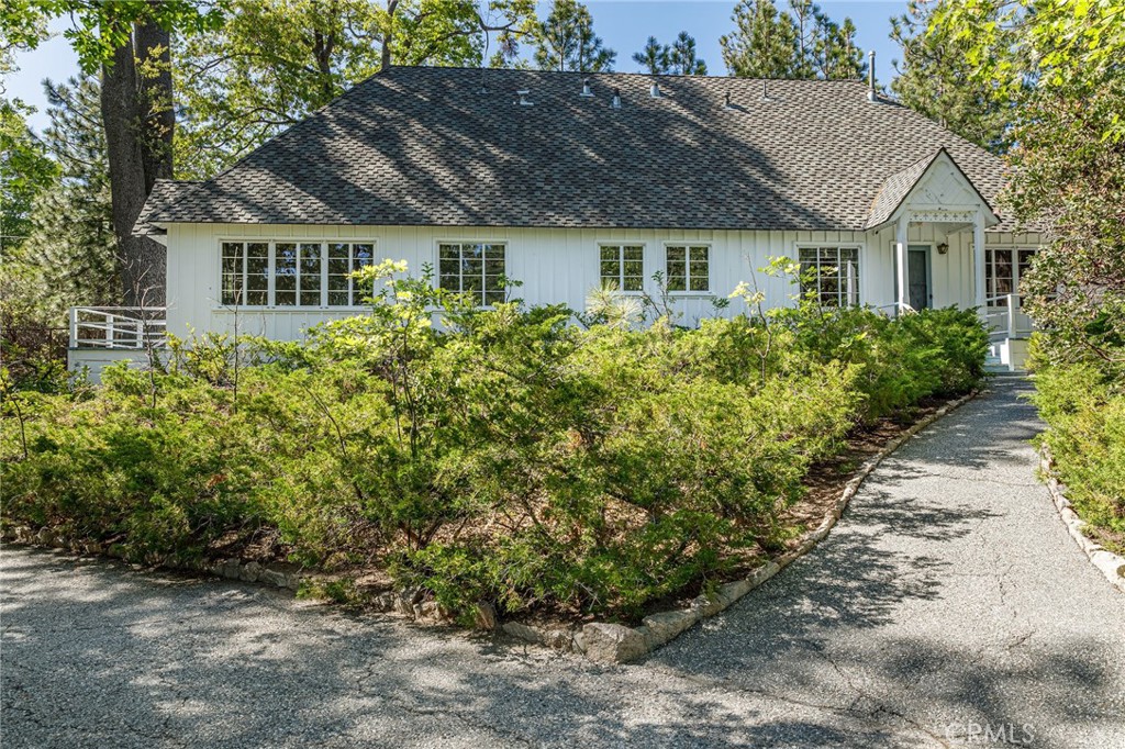 28641 North Shore Road Lake Arrowhead, CA 92352 - Photo 60 of 75 a front view of a house with a garden