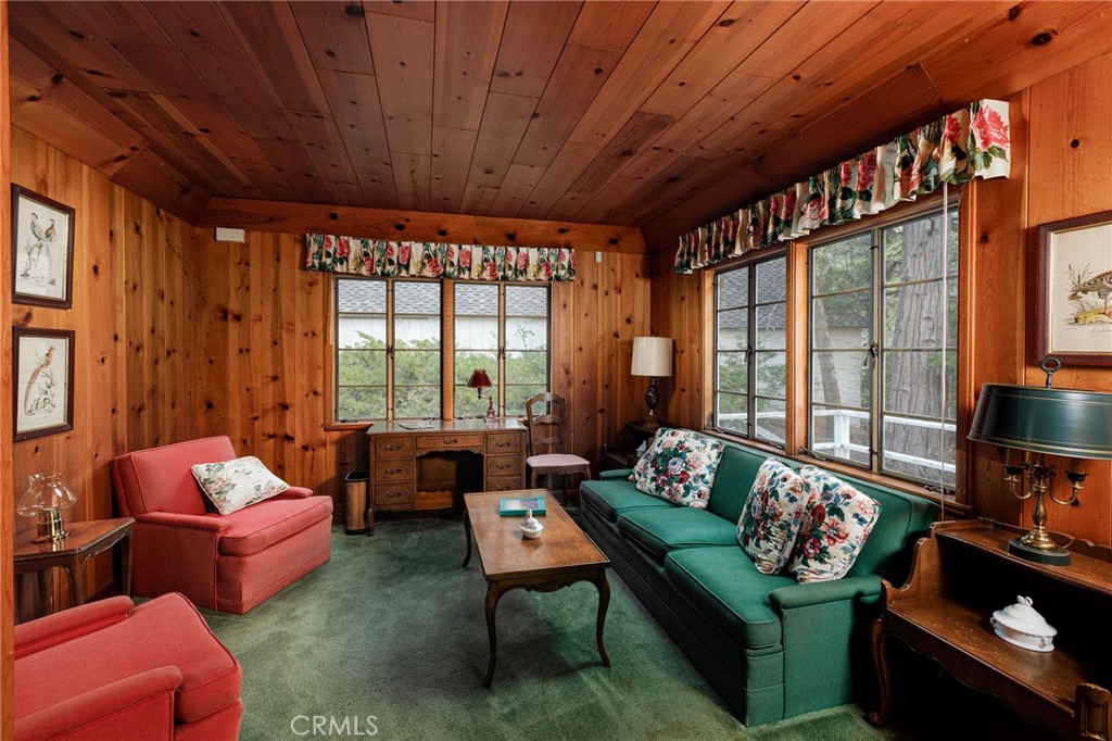 28641 North Shore Road Lake Arrowhead, CA 92352 - Photo 67 of 75 a living room with furniture and a floor to ceiling window
