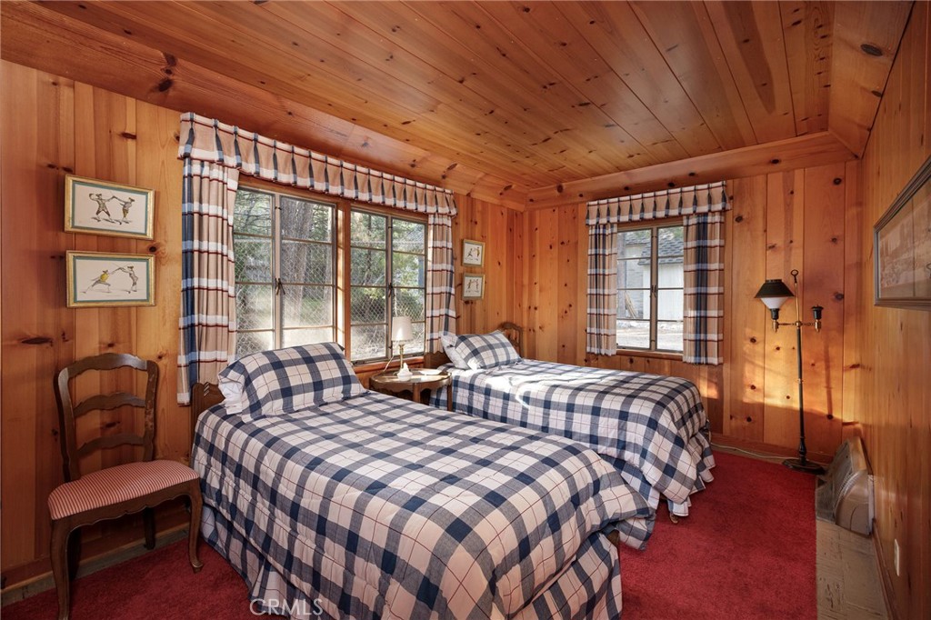 28641 North Shore Road Lake Arrowhead, CA 92352 - Photo 68 of 75 a bedroom with a bed and a couch