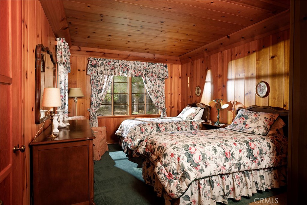 28641 North Shore Road Lake Arrowhead, CA 92352 - Photo 69 of 75 a bed sitting in a bedroom next to a window