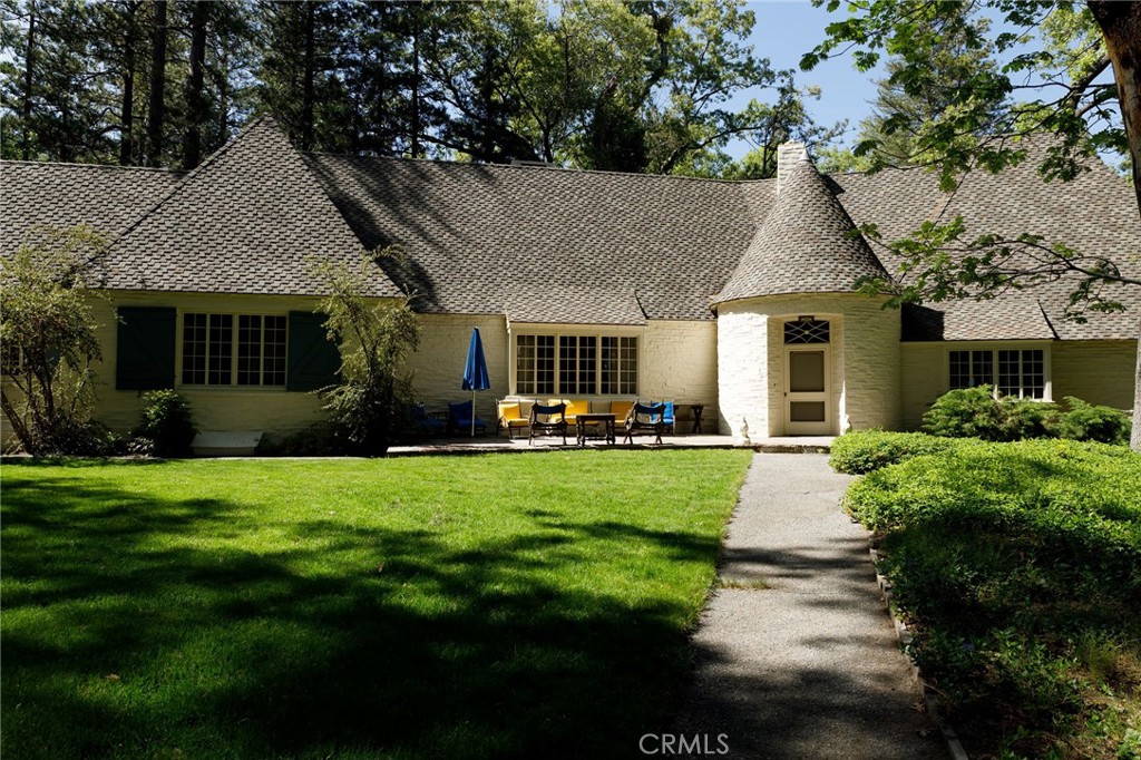 28641 North Shore Road Lake Arrowhead, CA 92352 - Photo 8 of 75 a front view of a house with a yard and green space