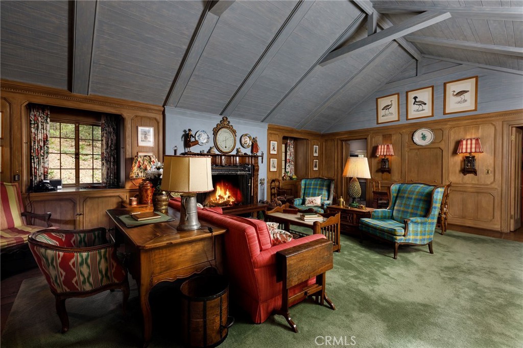 28641 North Shore Road Lake Arrowhead, CA 92352 - Photo 10 of 75 a living room with furniture a fireplace and a flat screen tv