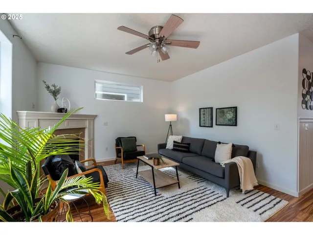 a living room with furniture and a rug