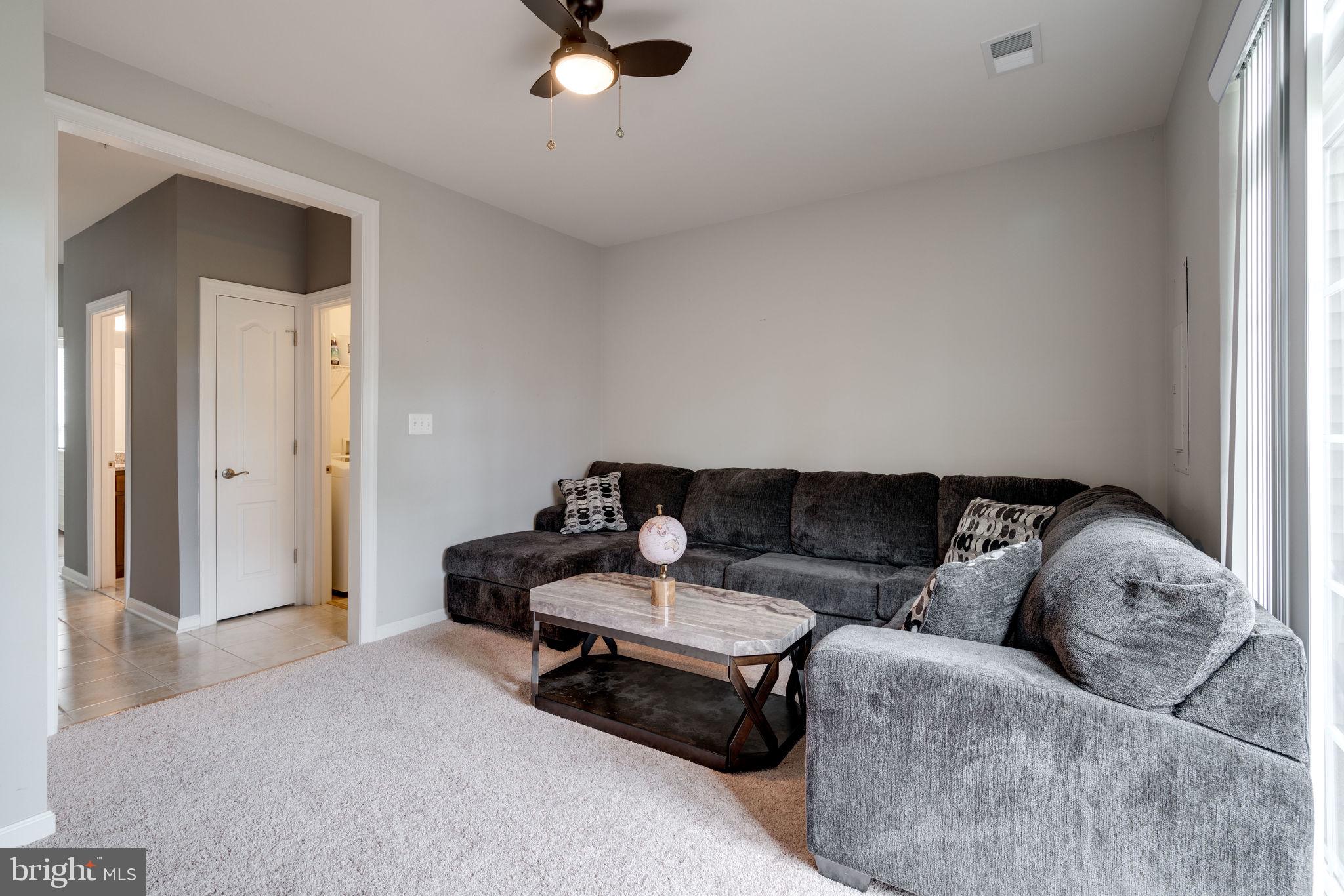 7452 Riding Meadow Way Manassas, VA 20111 - Photo 39 of 48 Main level living room / Laundry acces