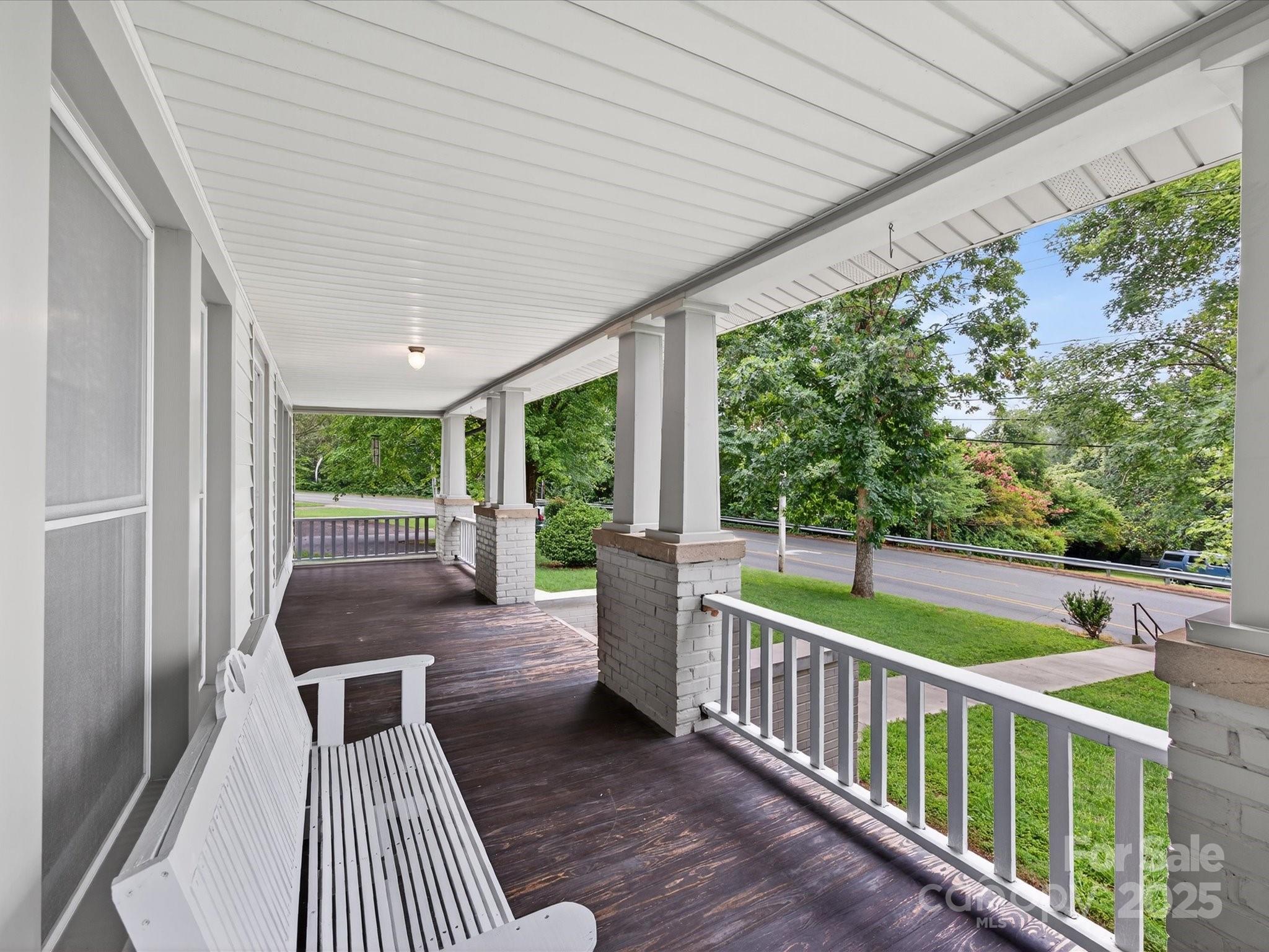808 West Union Street Morganton, NC 28655 - Photo 15 of 40 a balcony with wooden floor and outdoor seating