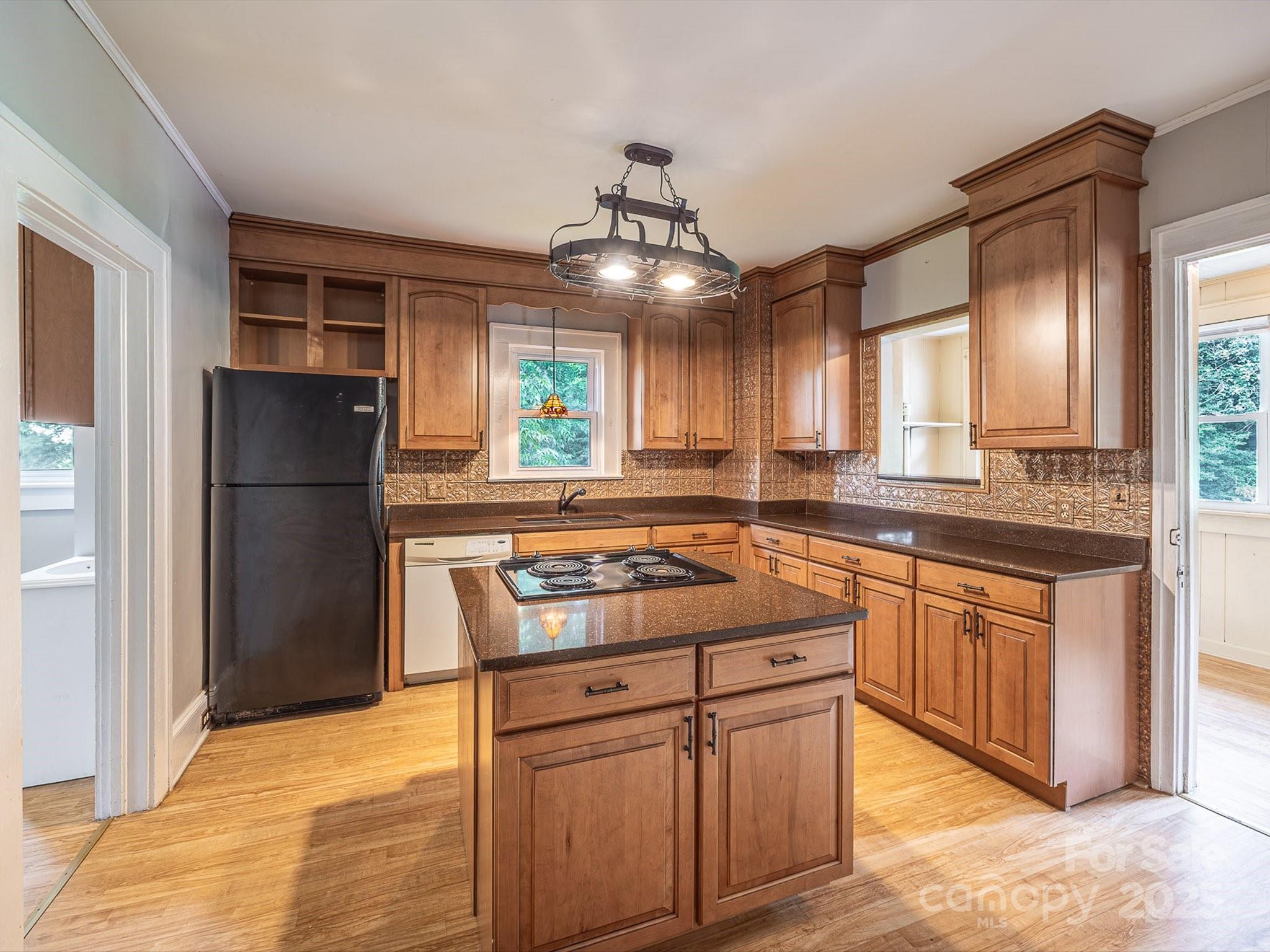 808 West Union Street Morganton, NC 28655 - Photo 22 of 40 a kitchen with stainless steel appliances granite countertop a refrigerator a sink and a stove