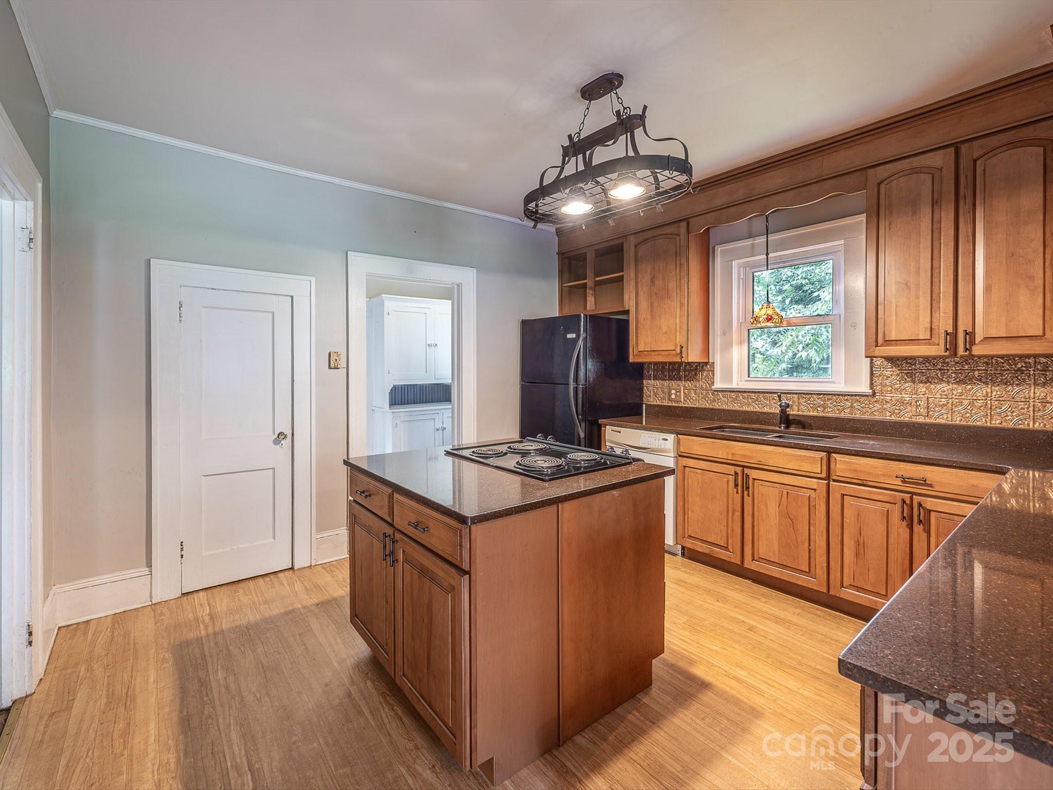 808 West Union Street Morganton, NC 28655 - Photo 23 of 40 a kitchen with stainless steel appliances granite countertop a stove and a sink