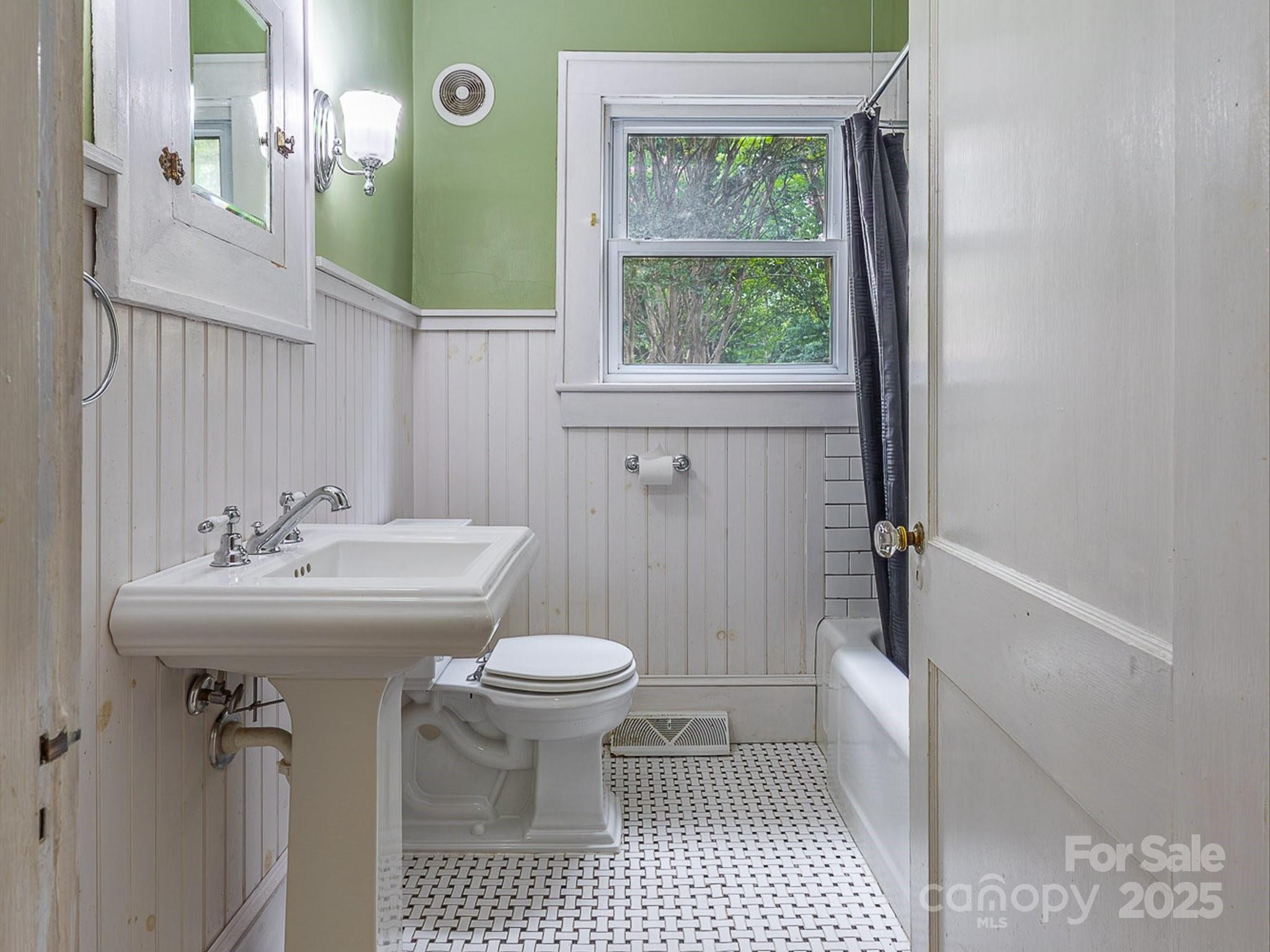 808 West Union Street Morganton, NC 28655 - Photo 26 of 40 a bathroom with a sink a toilet and shower
