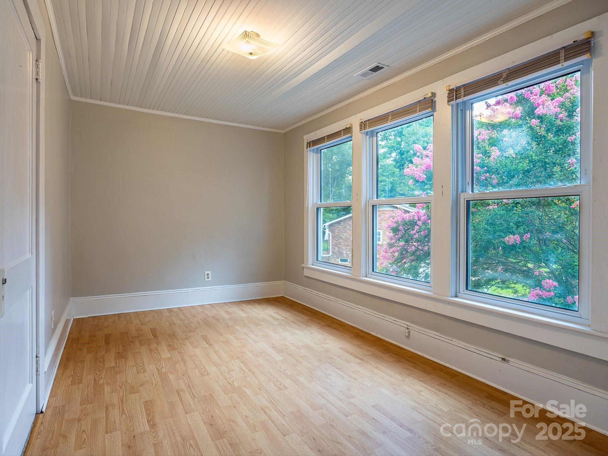 808 West Union Street Morganton, NC 28655 - Photo 34 of 40 a view of room with window and wooden floor