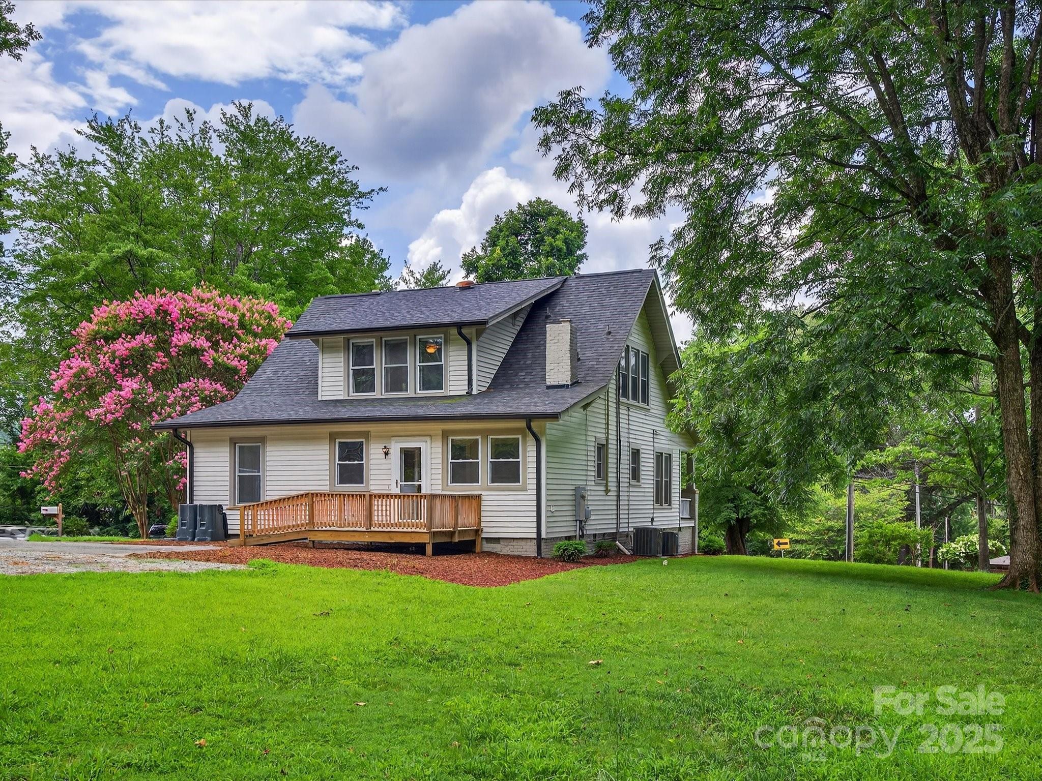 808 West Union Street Morganton, NC 28655 - Photo 9 of 40 a front view of a house with a garden and trees