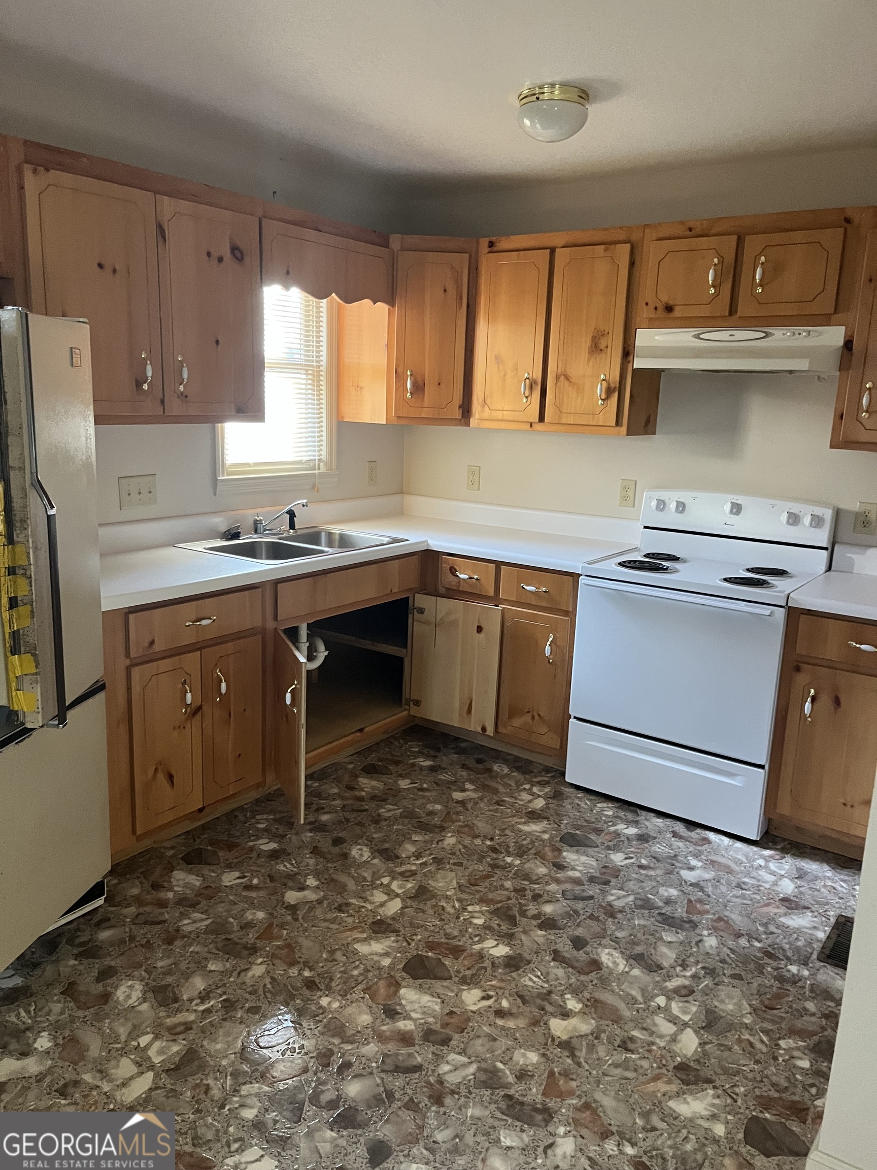 56 Carin Lane Tiger, GA 30576 - Photo 3 of 15 a kitchen with a sink stove and cabinets