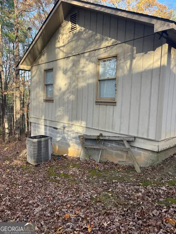 a bathroom with a granite countertop sink and a bathtub