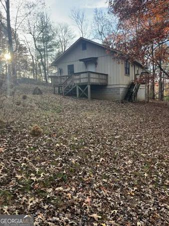 a house view with a backyard space