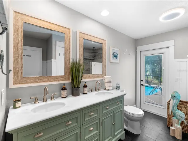 a bedroom with furniture and painting on the wall