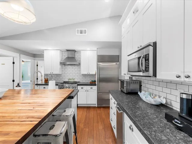 a bedroom with a bed and a table