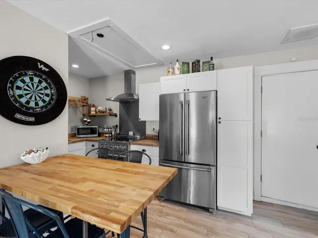 a bathroom with a sink vanity and mirror